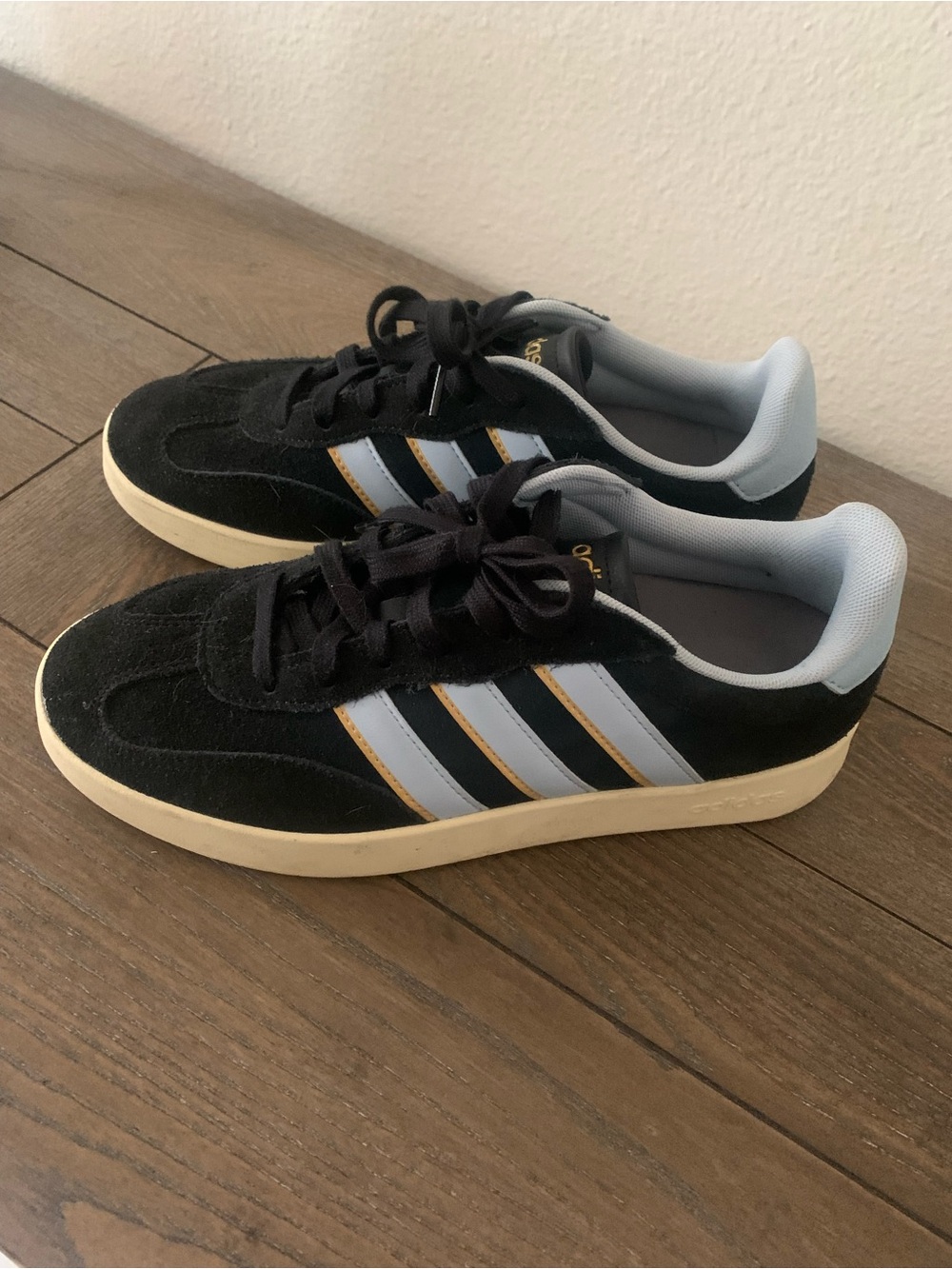 adidas Black Suede Sneakers with Light Blue Stripes and Gold Trim